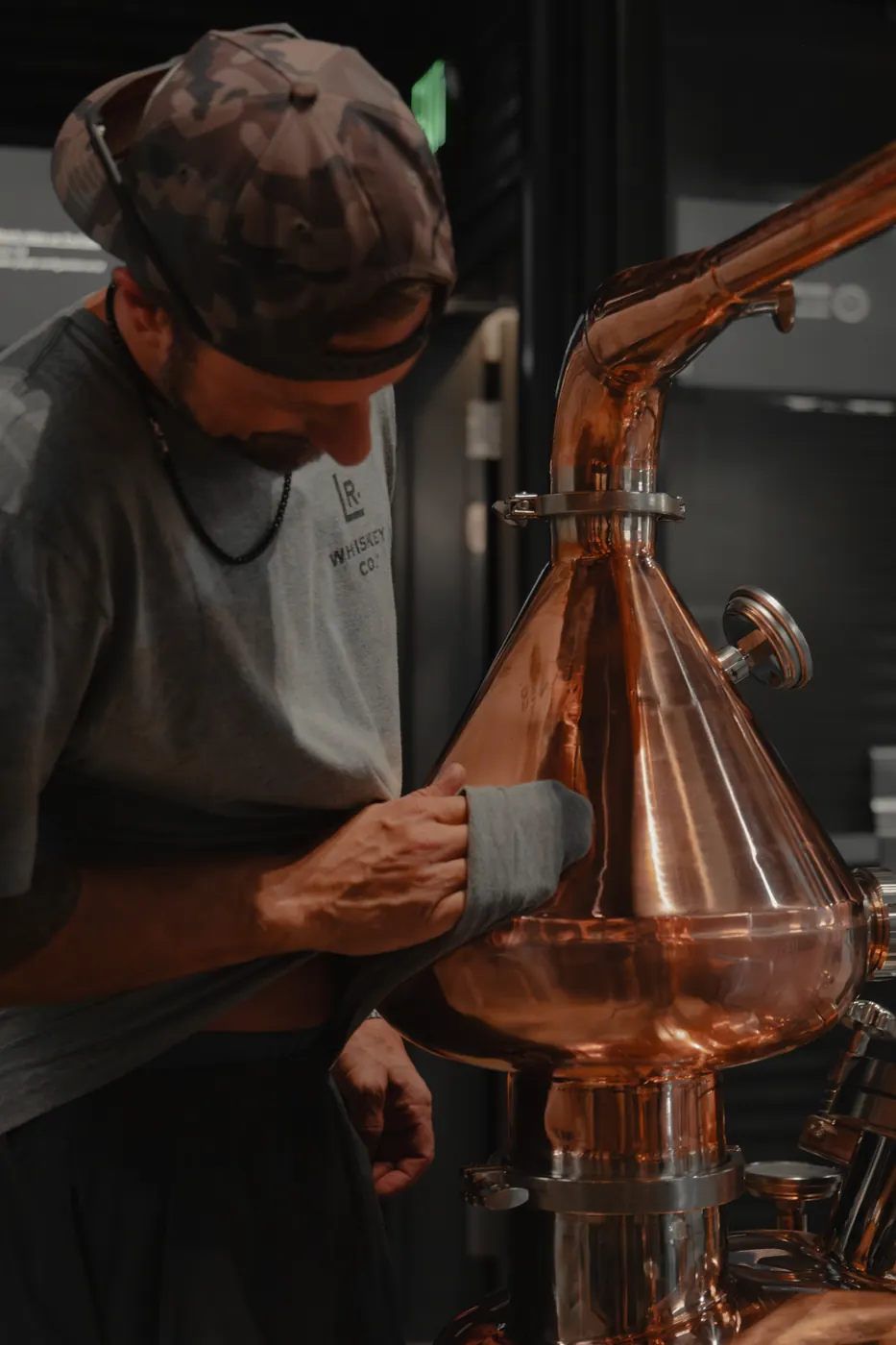 Polishing the copper pot still at Louisville Rickhouse Whiskey Co.
